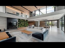 Modern Concrete Living Room with Minimalist Design and Verdant Indoor Jungle