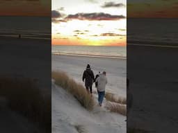 Walking Along The Beach During A Beautiful Sunset
