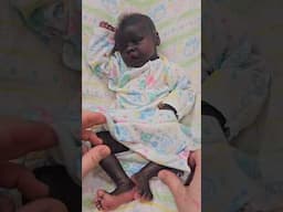 Changing my reborn doll into baby clothes