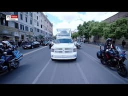 Thousands line the streets of Rome as Popemobile passes carrying coffin