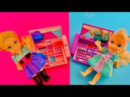 Elsa and Anna toddlers play with make up