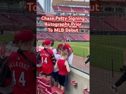 Chase Petty signing autographs for kids before his MLB debut for the Cincinnati Reds.