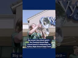 Fleming Island band at Eagle Harbor to celebrate the VyStar High School Debit Card program.