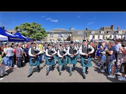Dunnottar Pipes & Drums playing Green Hills on march through crowds at 2024 Stonehaven Feein' market