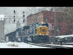 Heavy coal train struggles to get moving in snowstorm