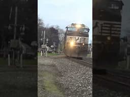 Norfolk Southern train hits the horn as it rounds the bend.