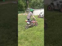 my son fixin' to wheelie for the first time.
