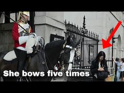 Japanese tourist bows 5 times to the Royal Kings Guard