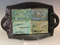 Making hand built whale trays with handles.