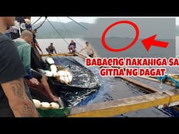 BABAENG NAKAHIGA SA GITNA NG DAGAT