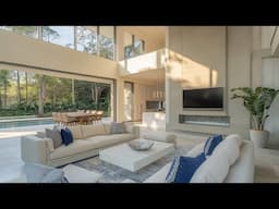 Tropical Modern Living Room with Natural Light and Water Reflection
