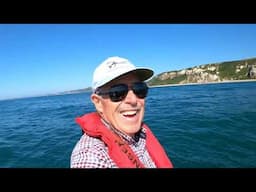 Man Fishing Alone in a boat on Jurassic Coast: Rough Sea Surf n’ Turf Cookup
