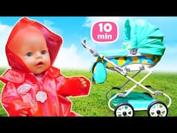 Baby Annabell doll puts on rain boots and a raincoat, and goes for a walk in the park.