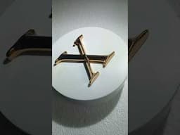 Cast Bronze Letter with a polished finish.