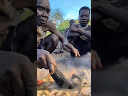 Hadza father cooking for his family #hadzatribe #africa #baboonhunt #4khunting #youtubeshorts