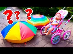 Baby Annabell doll plays with the colorful sand at the beach. Feeding the baby doll with toy food.