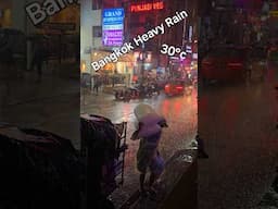 Iceman keeps Working in Bangkok Heavy Rain Sukhumvit Soi 11 Rainy Season Monsoon Thailand