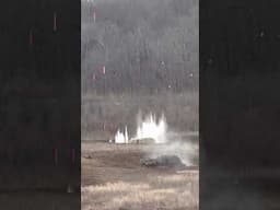 Watch a helicopter rain fire on a training ground