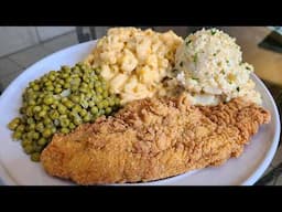 Fried catfish baked macaroni green peas and potato salad