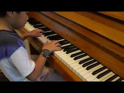 Zac Mak playing his favorite tunes by ear