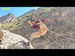 A journey to nomadic life; A father crosses an iron wire over a river for his son's future