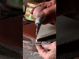 Clive Bowen using a tile press