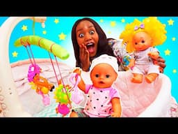 Baby Annabell doll needs a new crib mobile. Nanny calms down crying baby born dolls.