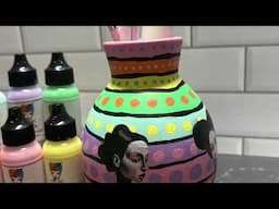Collaging on ceramic pots