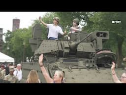 DC Military Parade Attendees Pose with Weapons and Tanks
