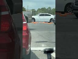 Boxes of orange soda spilled across the intersection of Coursey Boulevard and Airline Highway