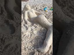 😂 That person in the background #sandsculpture #barbados #beach #travel #beachlife #mermaid