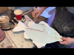 Glazing demonstration on fish and hand built trays.
