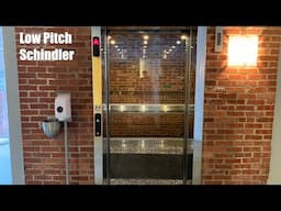 Low Pitch Glass Schindler Elevator at 2840 Liberty Ave in Pittsburgh, PA