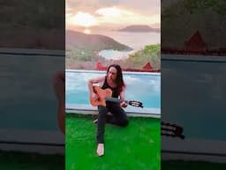 Practicing guitar overlooking Zihuatenajo MEXICO