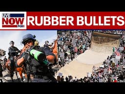 Los Angeles authorities use 'less lethal' weapons against protesters