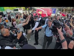 Russell Brand enters and exits Westminster Magistrates Court in London