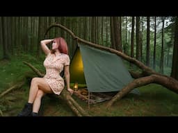 Beautiful girl builds bushcraft shelter under a fallen tree—solo camping without a tent