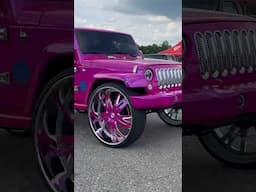 Candy Magenta Jeep on 32’s Riding at the Carshow