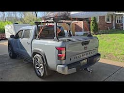 Loaded up TruXedo Elevate adjustable Bed Rack Nissan Frontier full load for trade show displays