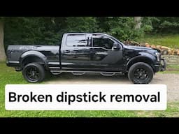 Removing a broken dipstick.