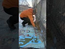 Cleaning Trash From a Pedestrian Bridge