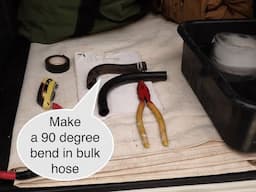 Making a car coolant hose in the bush