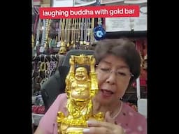 laughing buddha with gold bar