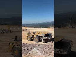 Massive Cat Wheel Loader Loading Cat Dumpers On A Quarry!