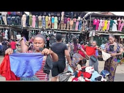 AFRICAN MUM SHOPPING FOR NEW FABRIC IN A VIBRANT NIGERIAN LOCAL MARKET @ IKOTUN LAGOS...