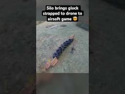 Glock strapped to drone @ airsoft game