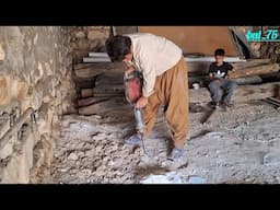 Breaking rocks with an iron machine
