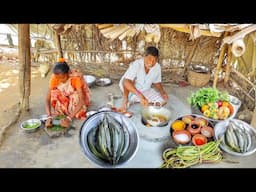 Niddle Fish curry with Taro root and shak vaji cooking for lunch by santali tribe old couple