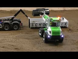 Small Mecalac wheelloader loads truck