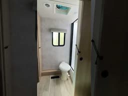 2025 Winnebago Minnie 2730FK has a queen bed slide, rear full bath, smart TV, tri-fold sofa and more